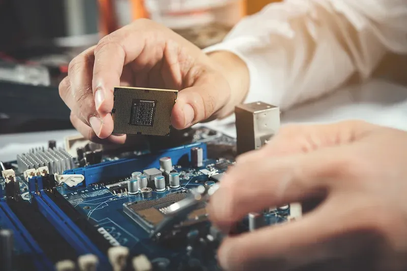 Technician repairing computer hardware